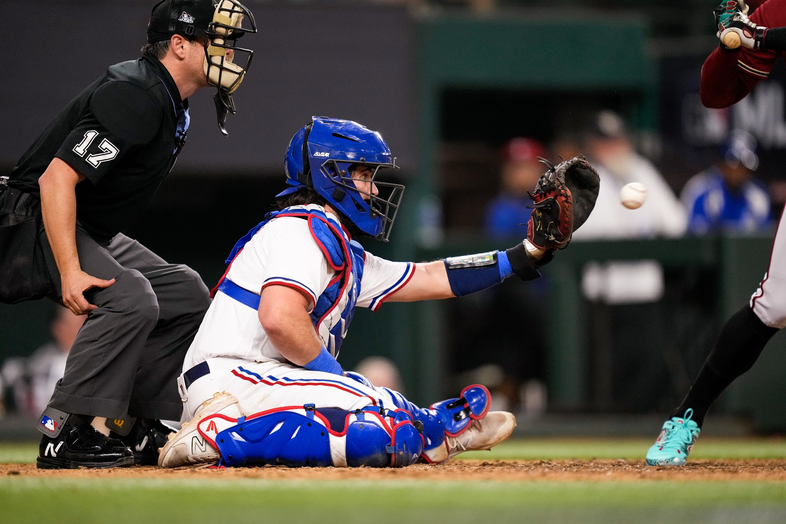 Austin Hedges #11 of the Texas Rangers catches the ball during Game One of the World Series against the Arizona Diamondbacks at Globe Life Field on October 27, 2023 in Arlington, Texas. (Photo by Bailey Orr/Texas Rangers/Getty Images)