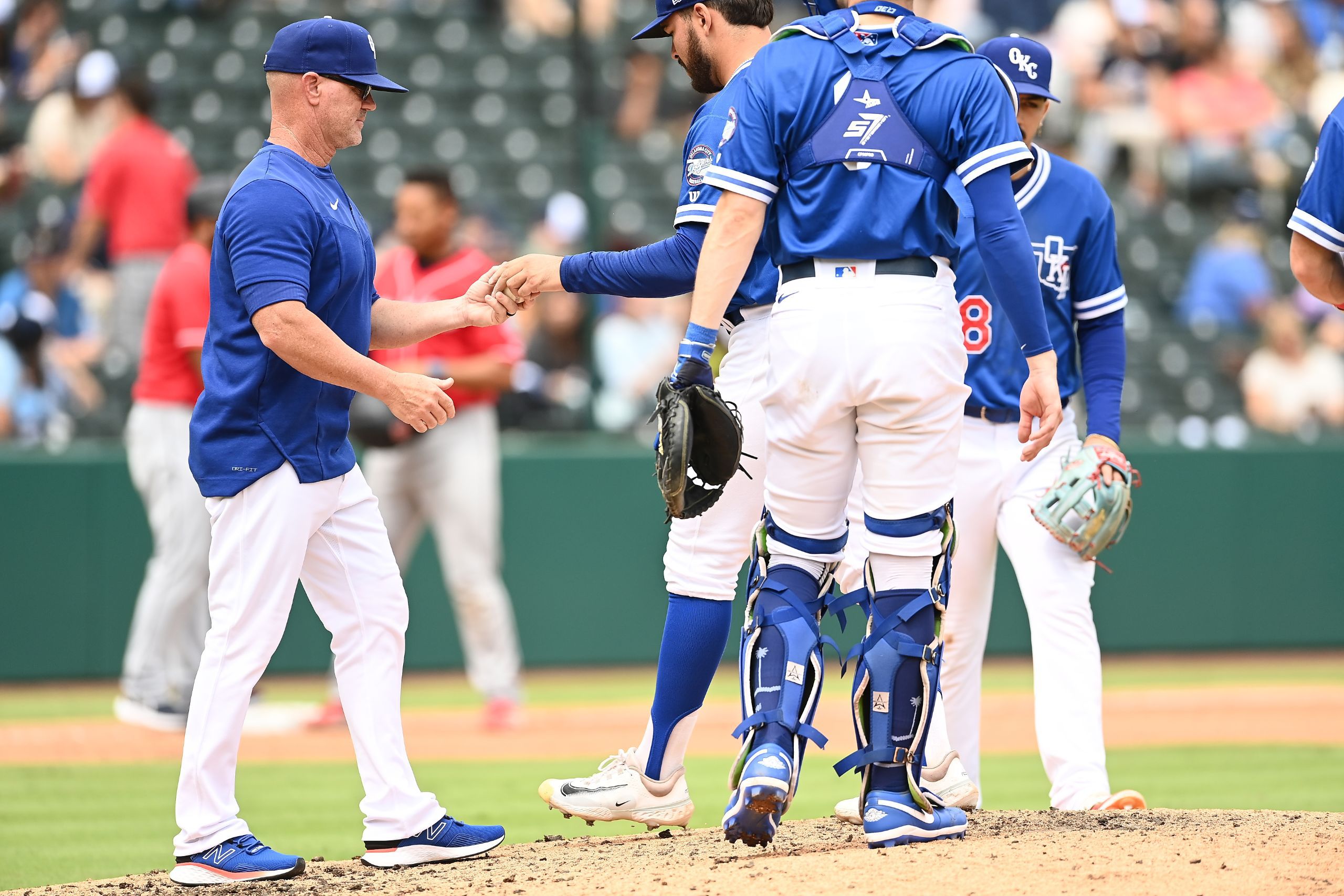 Oklahoma City Dodgers manager Travis Barbary makes a pitching change in a September 2023 MiLB game. (John Williamson/Four Seam Images)